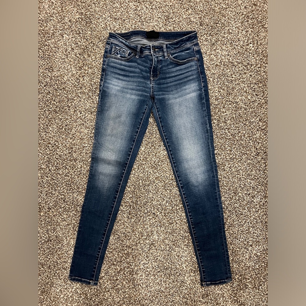 Buckle black skinny jeans